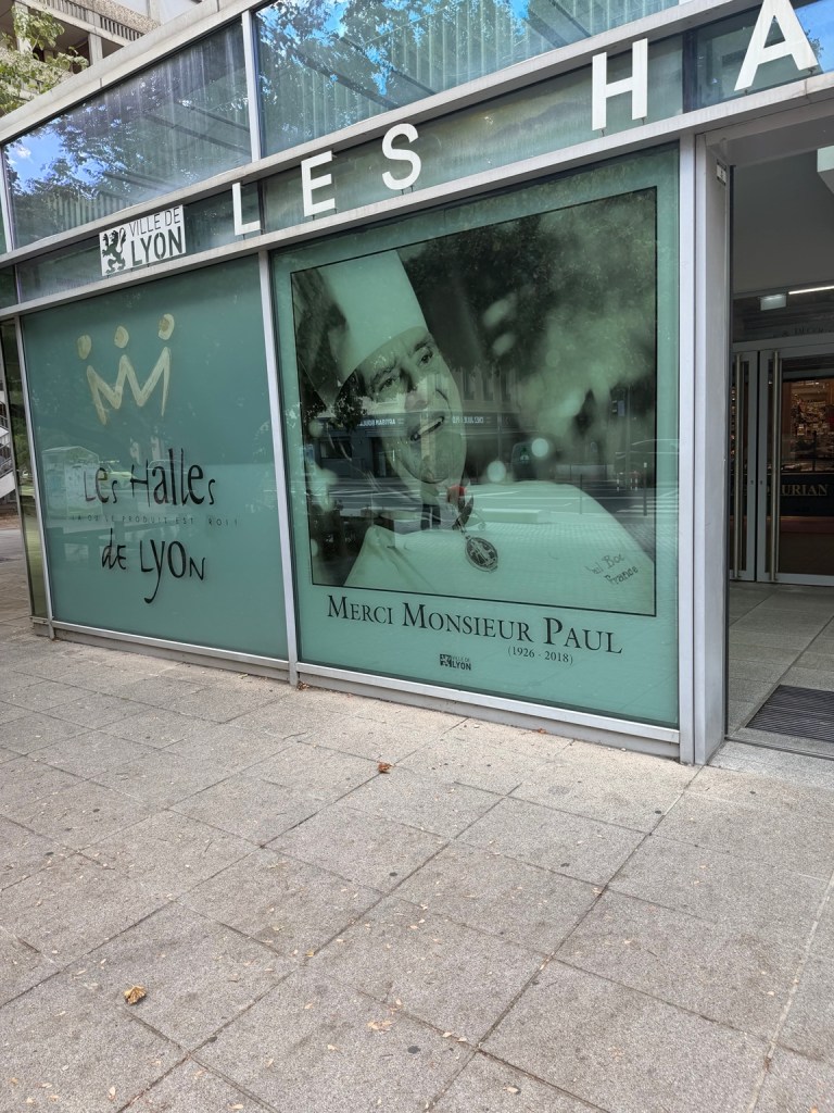Exterior of Les Halles de Lyon with a portrait of Paul Bocuse