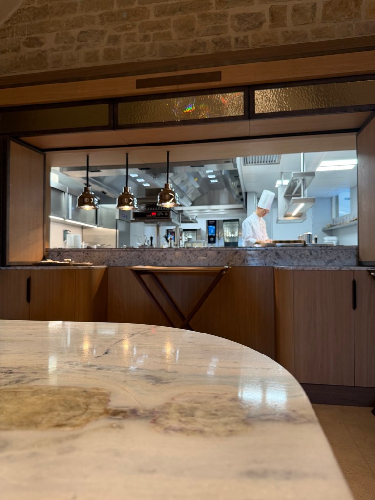 View from the chef’s table into the kitchen at Le VIII