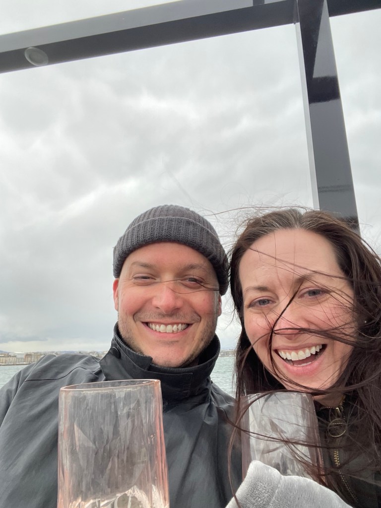 Lou and Bridget with drinks on their windy Lake Geneva boat ride