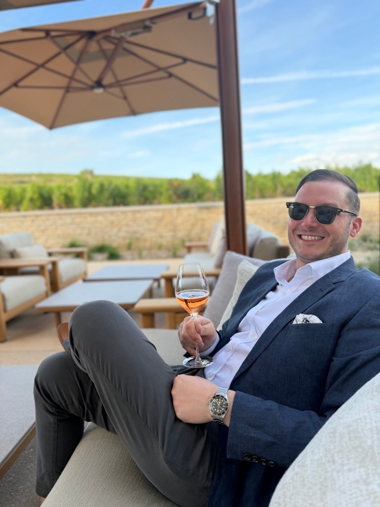 Lou celebrating his birthday with a glass of wine